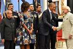 President Pranab Mukherjee and US First Lady Michelle Obama look on as US President Barack Obama shakes hands with Prime Minister Narendra Modi during a banquet hosted at the Rashtrapati Bhavan in New Delhi.
